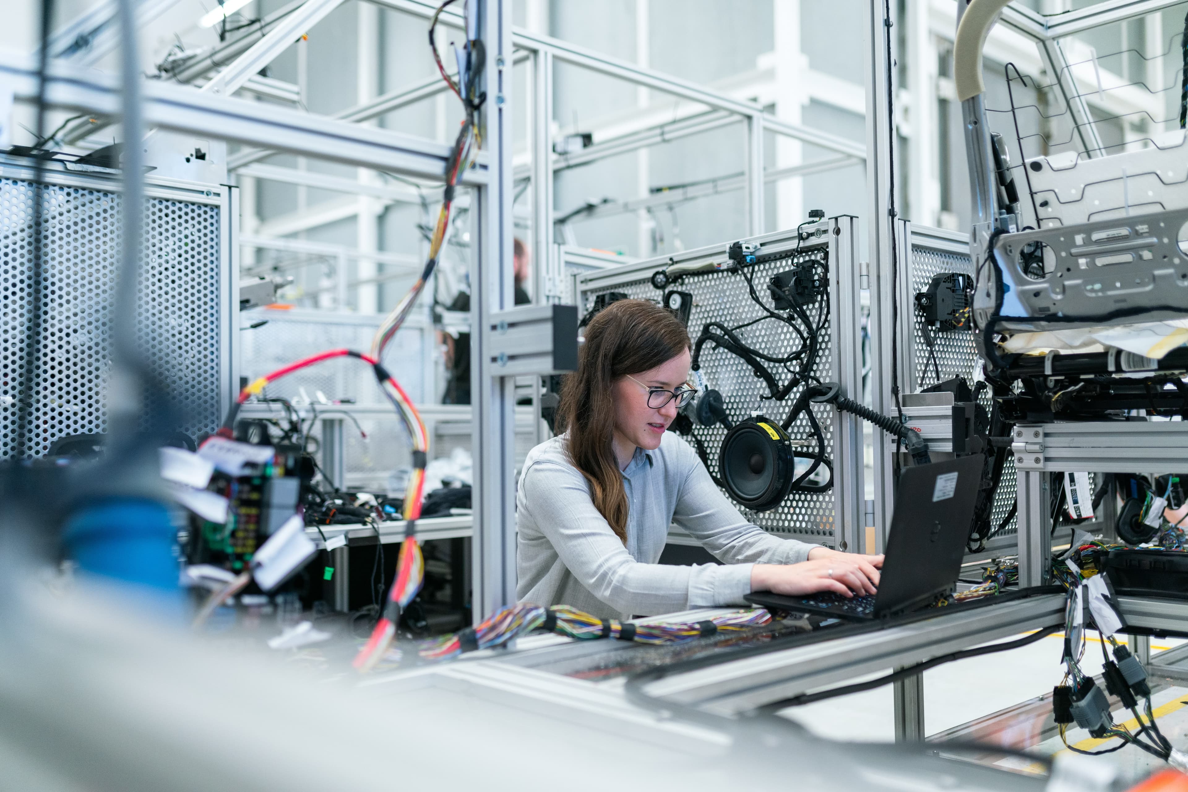 Employee in a factory that works with software