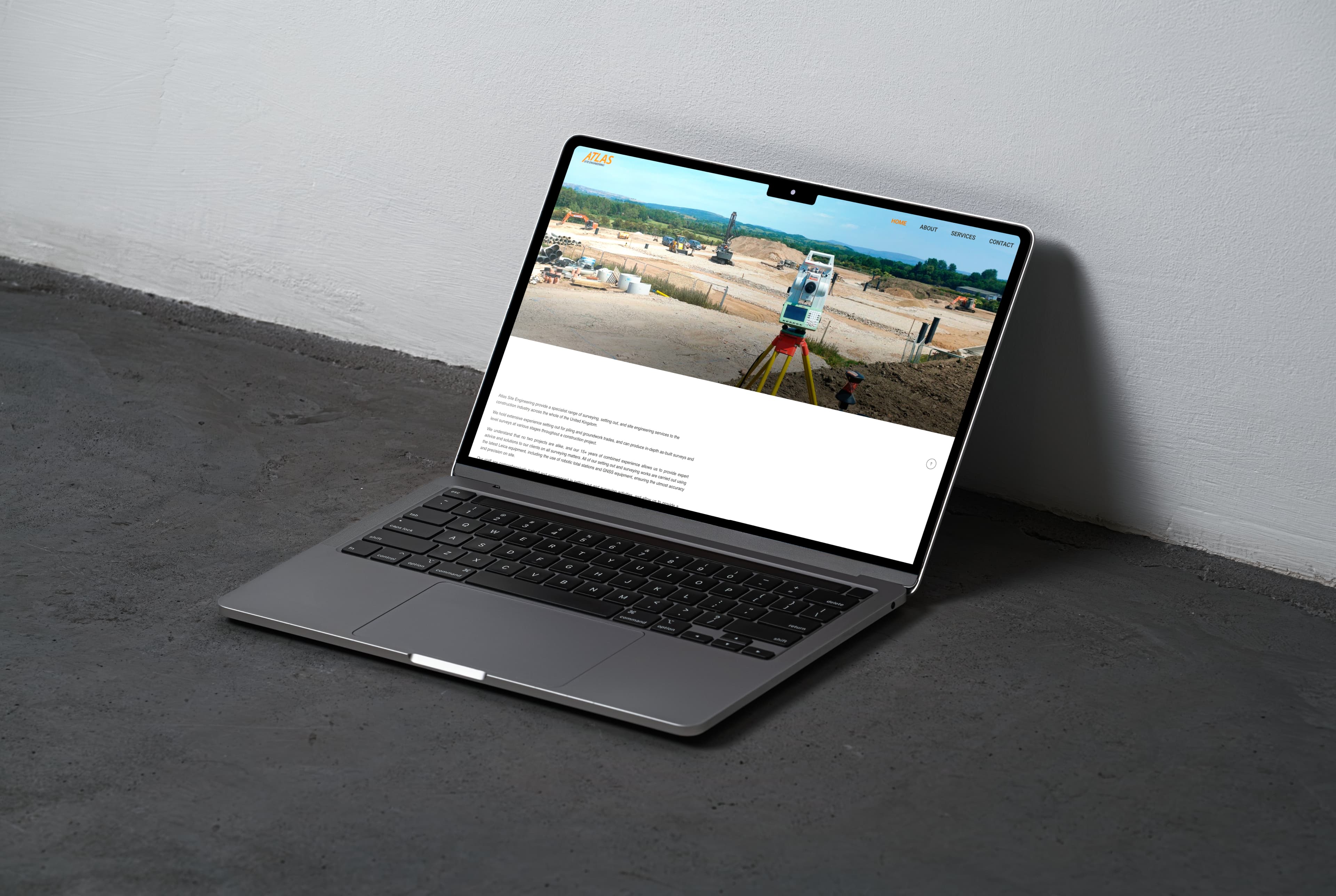 Atlas Site Engineering website on a laptop screen