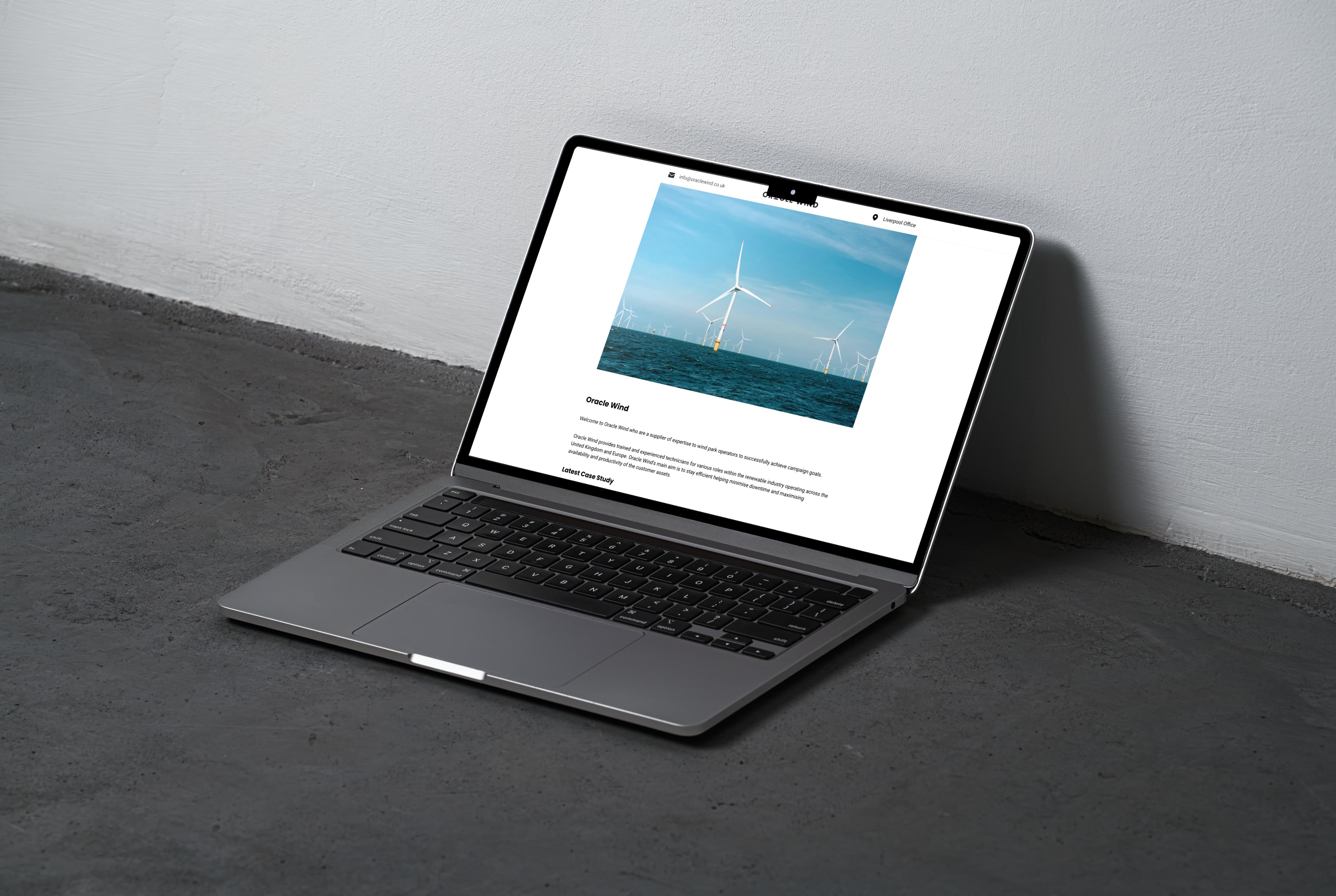 Oracle Wind website on a laptop screen